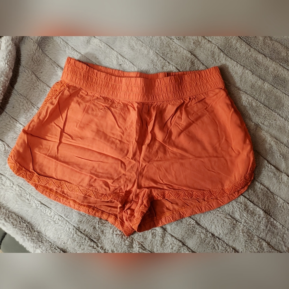 Orange soft shorts with embroidered edges